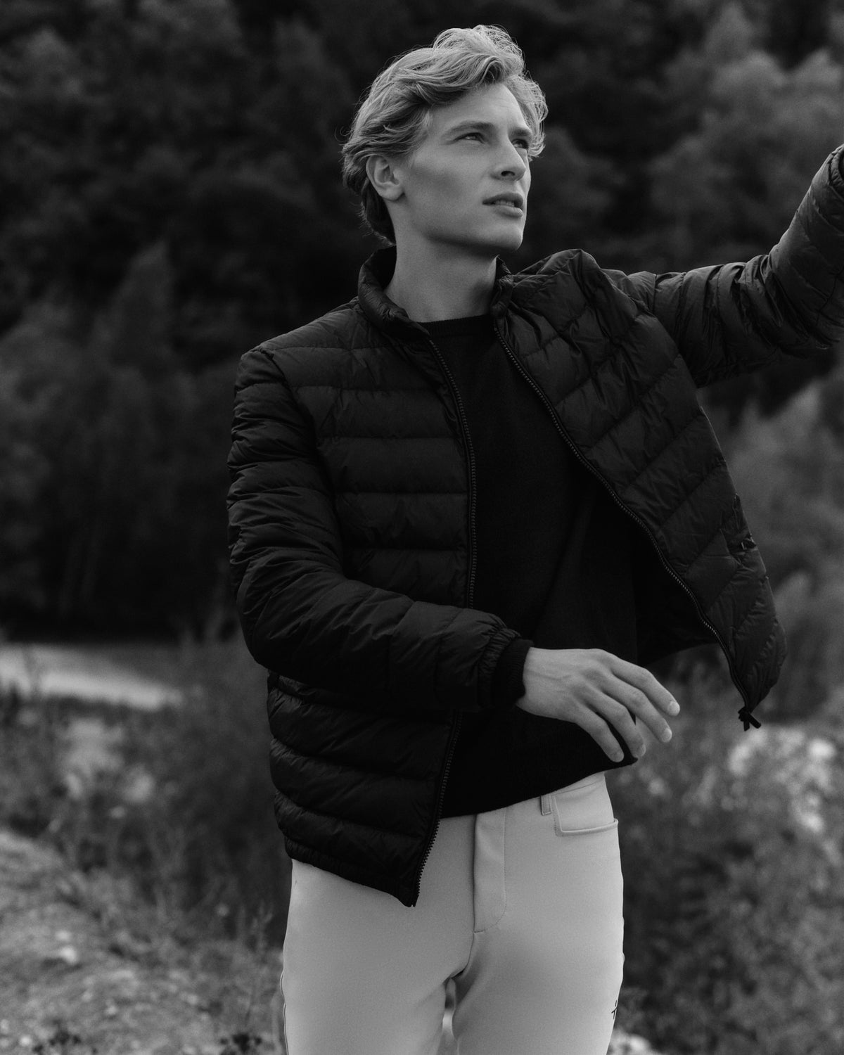 Light Goose Down Jacket in black, worn at Faxe Kalkbrud in the Trolle Projects AW26 campaign.
